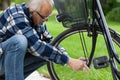 Man repairing bicycle wheel