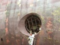 Man repairing bow thruster of huge vessel Royalty Free Stock Photo