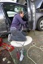 Man Repairing the Broken Car Door