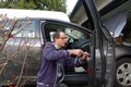 Man Repairing the Broken Car Door