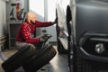Man repairing a car wheel in a garage Royalty Free Stock Photo