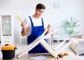 Man repairing chair in the room Royalty Free Stock Photo