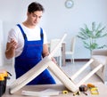 Man repairing chair in the room Royalty Free Stock Photo