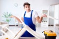 The man repairing chair in the room Royalty Free Stock Photo