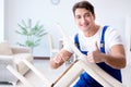 The man repairing chair in the room Royalty Free Stock Photo