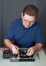 The man repairing DVD a player Royalty Free Stock Photo