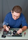 The man repairing DVD a player Royalty Free Stock Photo