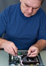 The man repairing DVD a player Royalty Free Stock Photo