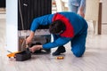 The man repairing fridge with customer Royalty Free Stock Photo