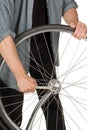 Man repairing front wheel on a bicycle