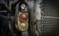 Man repairing headlight of old tractor. Royalty Free Stock Photo