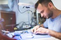 Man repairing mobile phone electronics service shop