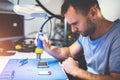 Man repairing mobile phone electronics service shop