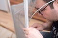 Man repairing mosquito net at home. Home improvement concept Royalty Free Stock Photo