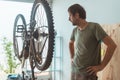 Man repairing old mountain bike in workshop