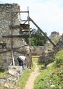 Man repairing of ruins of old monastery in Slovak Paradise