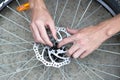 A man repairs a bicycle wheel