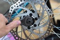 A man repairs a bicycle wheel