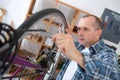 Man reparing bike in bicycle repair shop