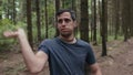 Man repel mosquitoes in the forest