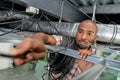 Man replacing ceiling wiring Royalty Free Stock Photo