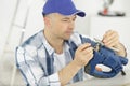 Man replacing electric jigsaw blade