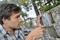 Man replacing intercom system Royalty Free Stock Photo