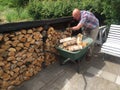 Man replenish fire wood