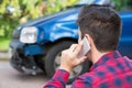 Man Reporting Car Crash On Mobile Phone Royalty Free Stock Photo