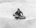 Man rescuing woman from ocean Royalty Free Stock Photo