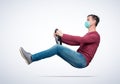 Man in respiratory mask drives a car while holding a steering wheel. Difficult period travel concept.