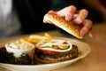 Man in restaurant eating hamburger Royalty Free Stock Photo