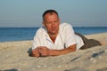 Man resting on the beach Royalty Free Stock Photo