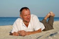 Man resting on the beach Royalty Free Stock Photo