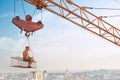 Man resting on construction on high and eating.