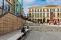 Man resting in front of the Reina Sofia Museum in Madrid Royalty Free Stock Photo