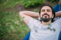 A man is resting in a hammock in a country house Royalty Free Stock Photo