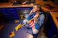 Man resting on the kitchen floor