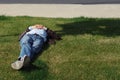 Man is resting on the lawn on a Sunny day Royalty Free Stock Photo