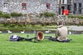 Man resting near a bike, with a river in the background, Galway, Ireland Royalty Free Stock Photo