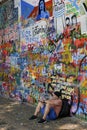 Man resting near the John Lennon Wall, Prague, Czech Republic Royalty Free Stock Photo