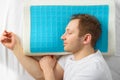 A man is resting on an orthopedic pillow. The concept of taking care of your health. Healthy sleep