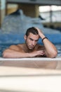 Man Resting Relaxed On Edge Of Swimming Pool Royalty Free Stock Photo