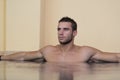 Man Resting Relaxed On Edge Of Swimming Pool Royalty Free Stock Photo