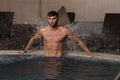 Man Resting Relaxed On Edge Of Swimming Pool Royalty Free Stock Photo