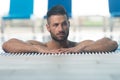 Man Resting Relaxed On Edge Of Swimming Pool Royalty Free Stock Photo