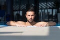 Man Resting Relaxed On Edge Of Swimming Pool Royalty Free Stock Photo