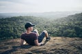 Man resting on rock over jungle Royalty Free Stock Photo