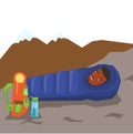 Man resting in sleeping bag in the mountains.