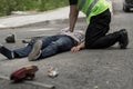 Man resuscitating car crash victim